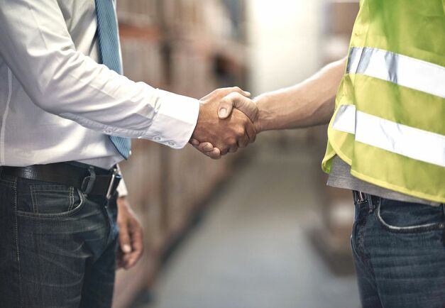 contractor shaking hands with apartment owner